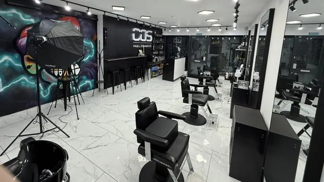 Inside: marble floor, black chairs and the bar